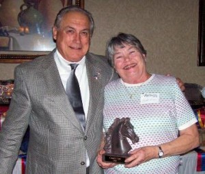 President Pete Jaeger presents Carol Lee (R) with the 2008 Jack Benny Award.